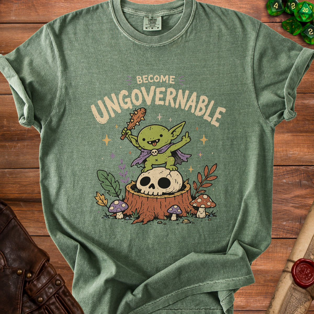Green t-shirt with a goblin holding a club and sitting on a skull.