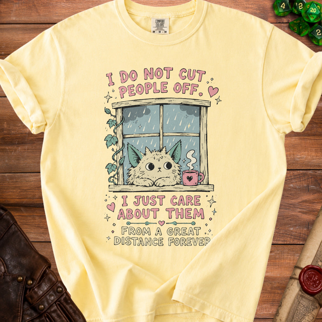 Yellow t-shirt with graphic of cat at window saying "I do not cut people off. I just care about them from a great distance forever."