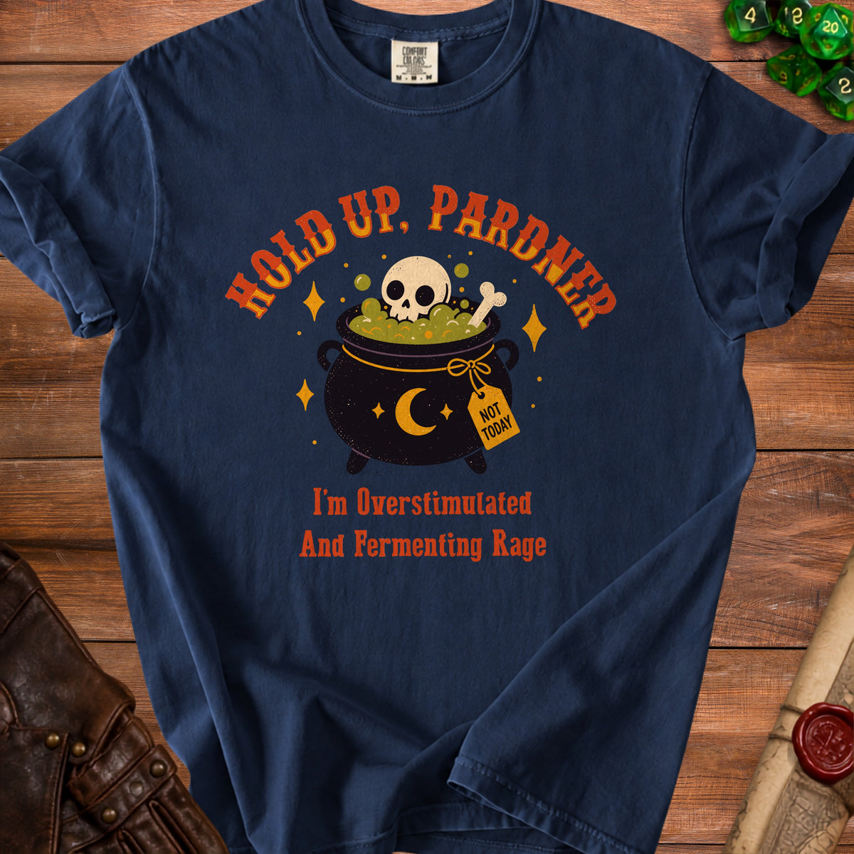 Dark blue t-shirt with text "HOLD UP, PARDNER" and a skull in a cauldron.