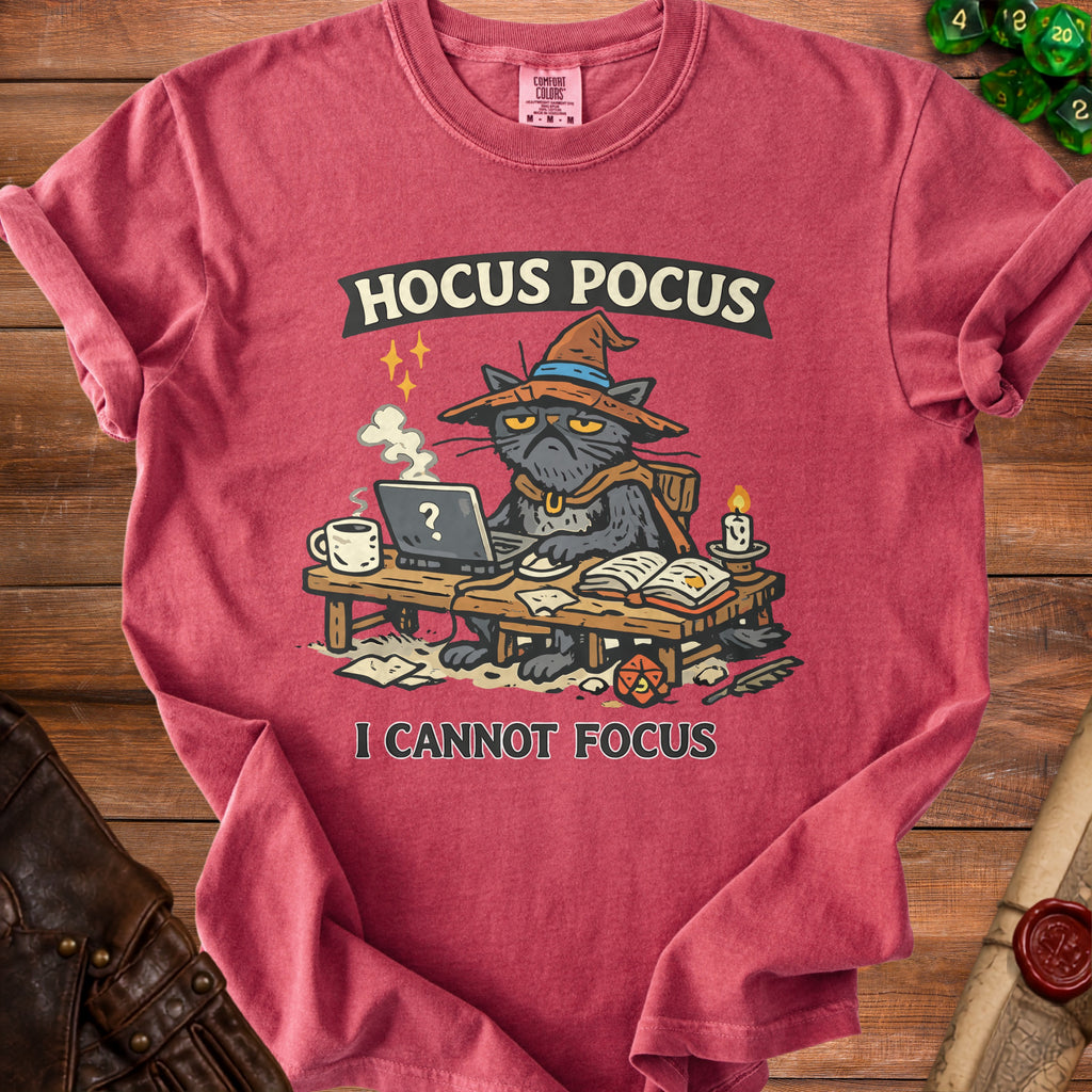 Red t-shirt with a black cat in a witch hat working on a laptop, text "Hocus Pocus I Cannot Focus".