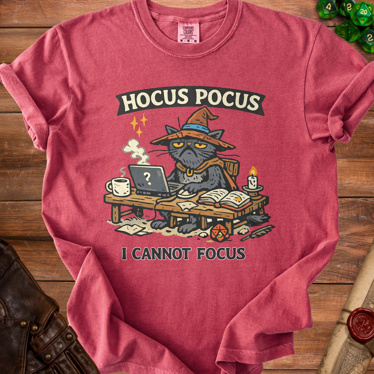 Red t-shirt with a black cat in a witch hat working on a laptop, text "Hocus Pocus I Cannot Focus".