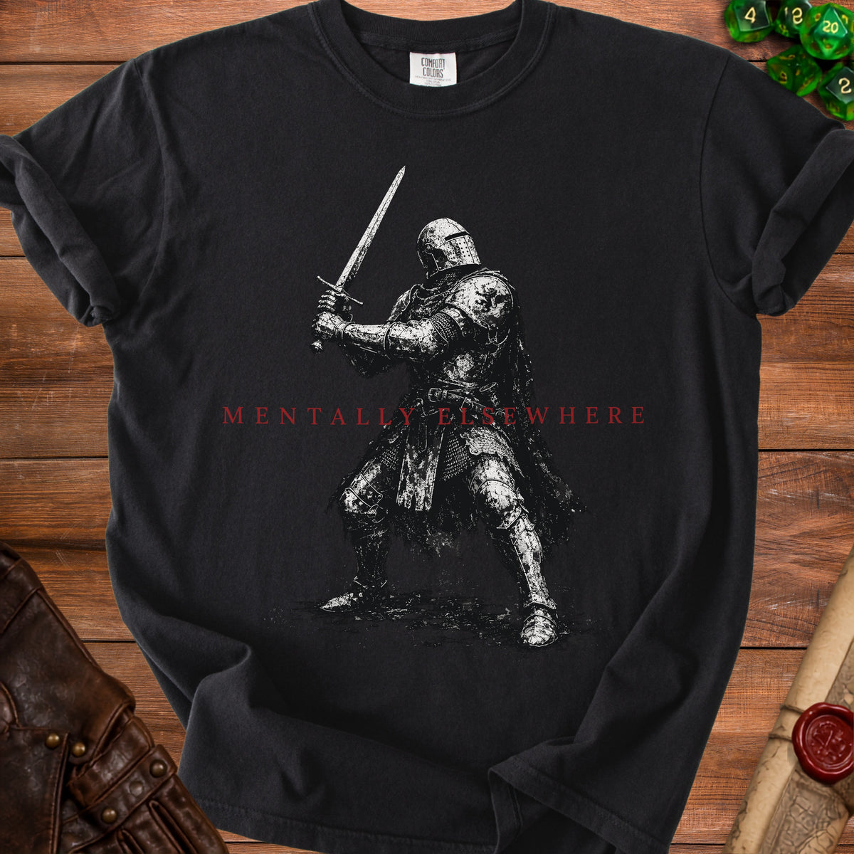 Black t-shirt with a knight holding a sword and the text "MENTALLY ELSEWHERE".