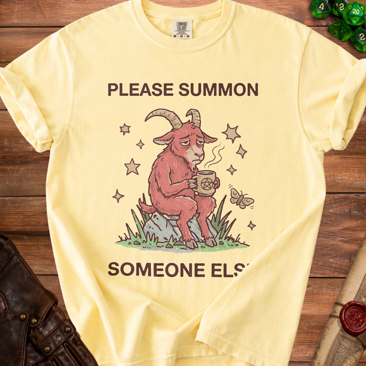 Yellow t-shirt with text "PLEASE SUMMON SOMEONE ELSE" and a goat holding coffee.