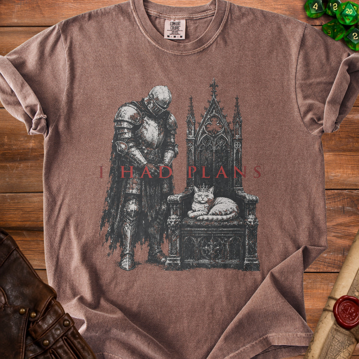 Knight beside throne with crowned cat, text "I HAD PLANS" on brown t-shirt.