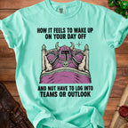 Teal shirt with knight in bed graphic and text "How it feels to wake up on your day off".