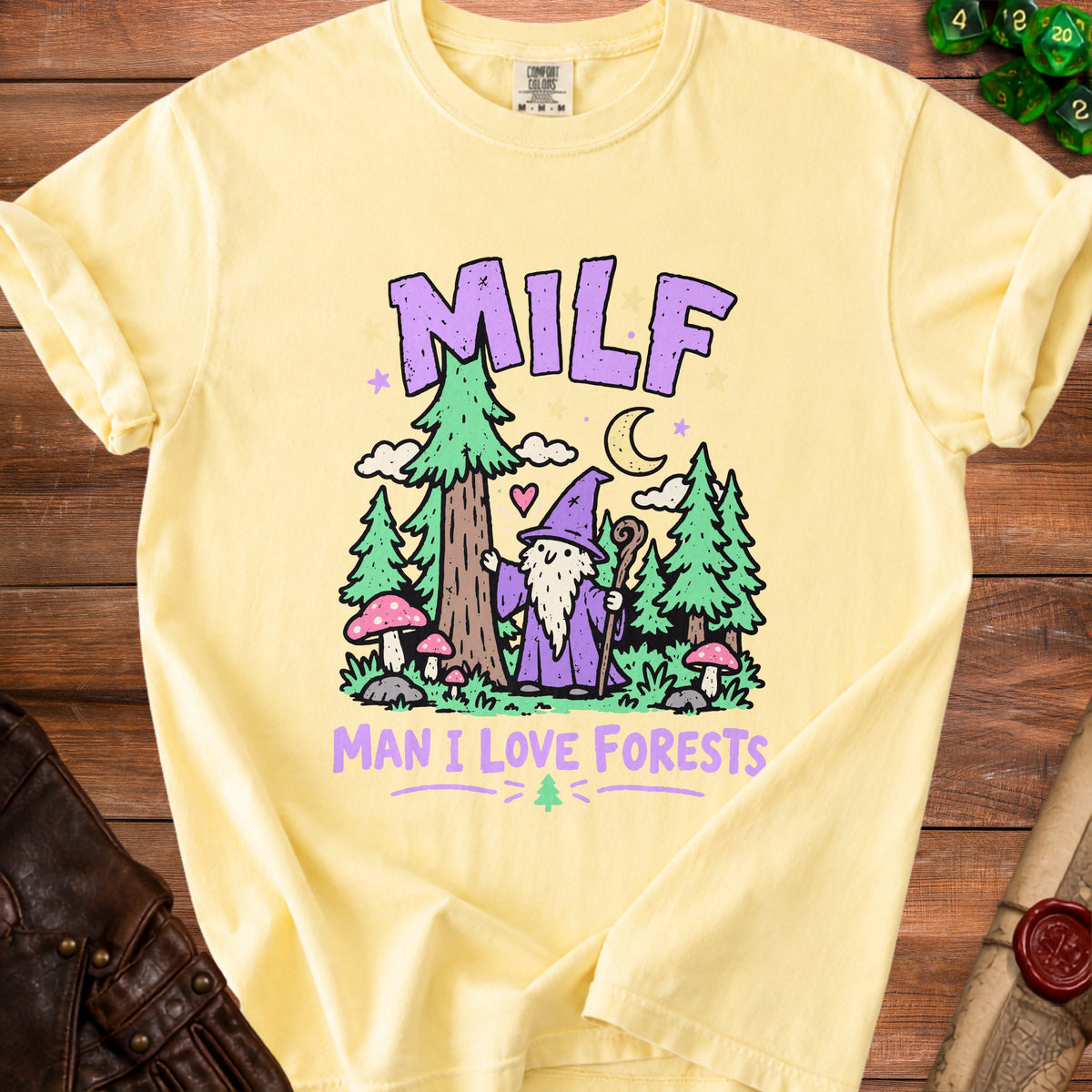 Yellow t-shirt with text "MILF MAN I LOVE FORESTS" and a gnome and forest illustration.