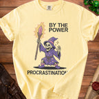 Yellow t-shirt with wizard skeleton graphic and text "BY THE POWER PROCRASTINATION"