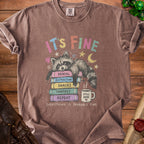 T-shirt with raccoon on books, "It's Fine" and "Everything is Probably Fine."