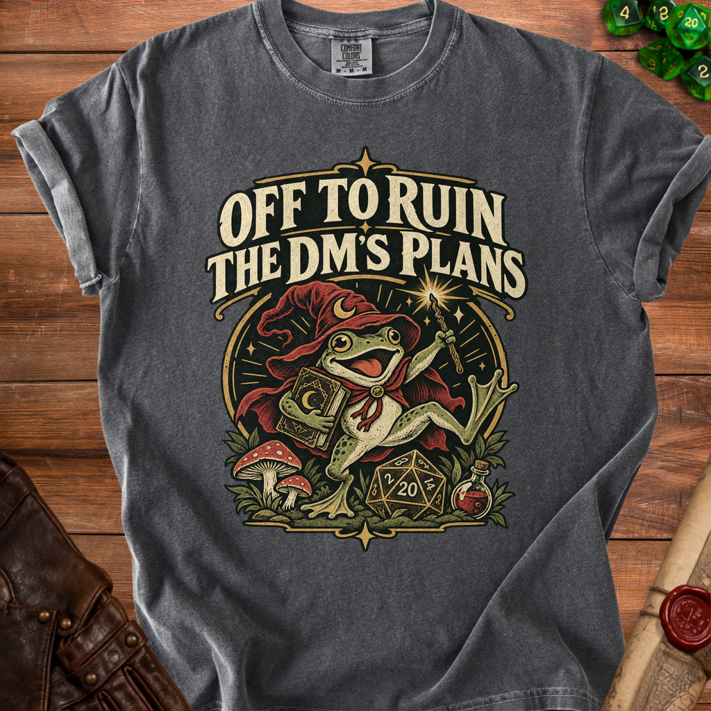 T-shirt with a frog wizard, D20 die, potion, and mushrooms, reading "Off to Ruin the DM's Plans".