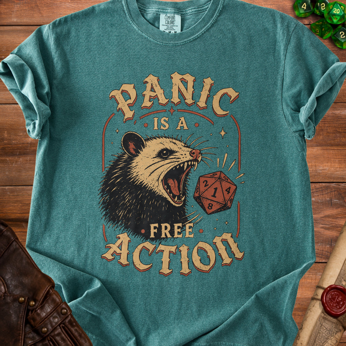 T-shirt with a graphic of a screaming opossum and the words "PANIC IS A FREE ACTION."