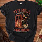 Black t-shirt with a devil and flames, reading "IT'S HELL OUT THERE STAY INSIDE".