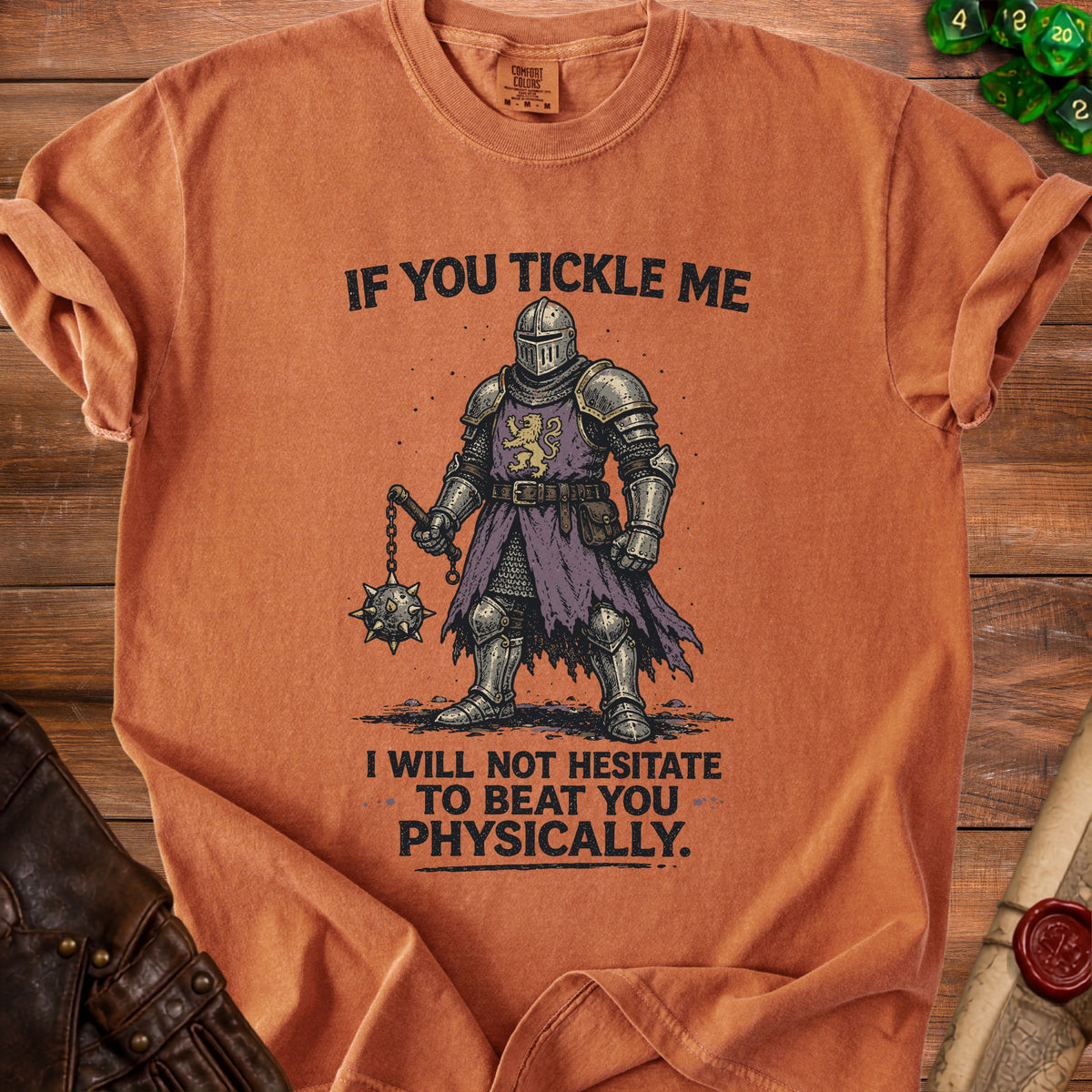 Orange t-shirt with knight illustration and "If you tickle me I will not hesitate to beat you physically" text.