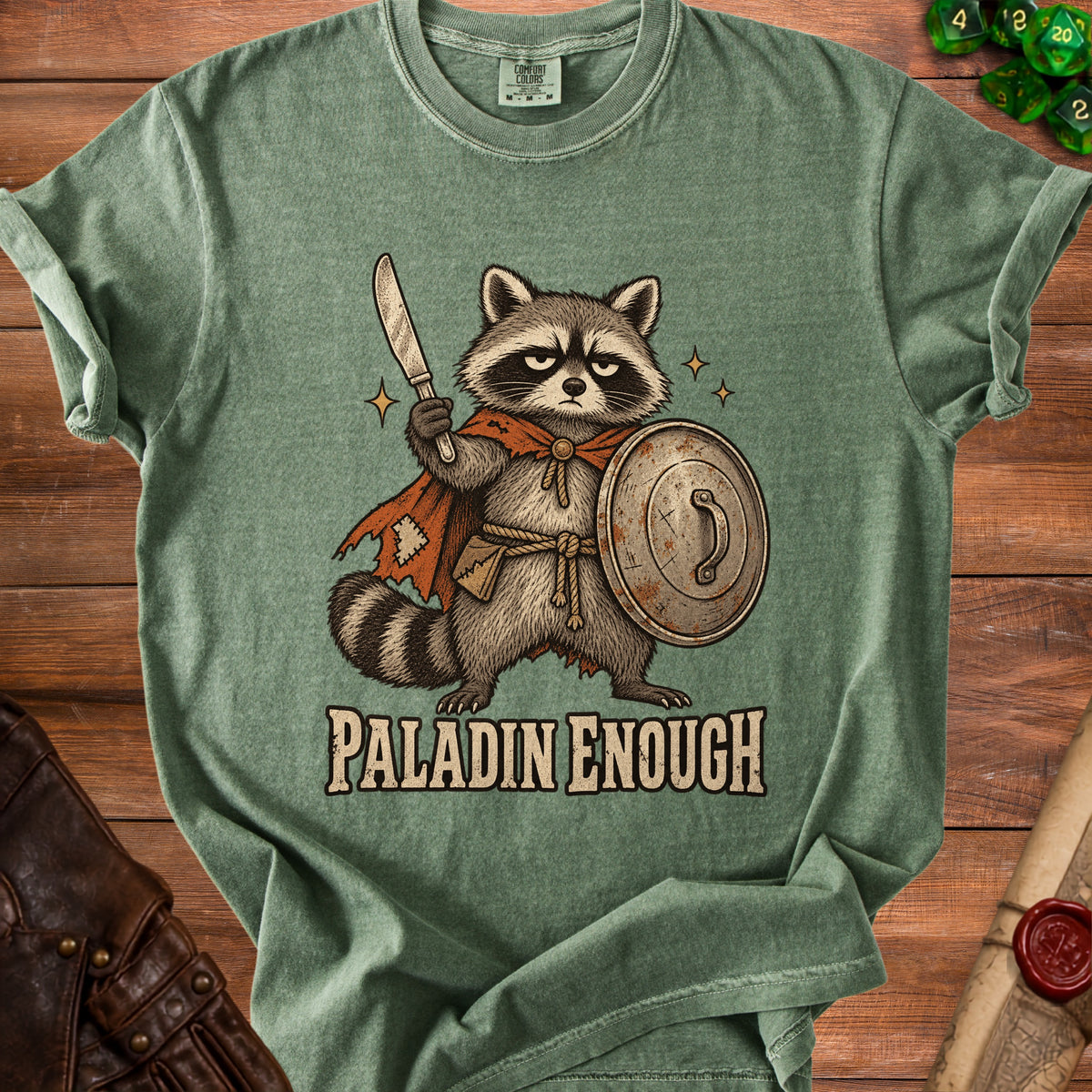 Green t-shirt with a raccoon knight holding a sword and shield, text "PALADIN ENOUGH".