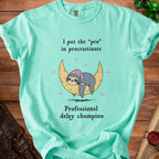 Mint t-shirt with sloth on moon and text "I put the 'pro' in procrastinate Professional delay champion".