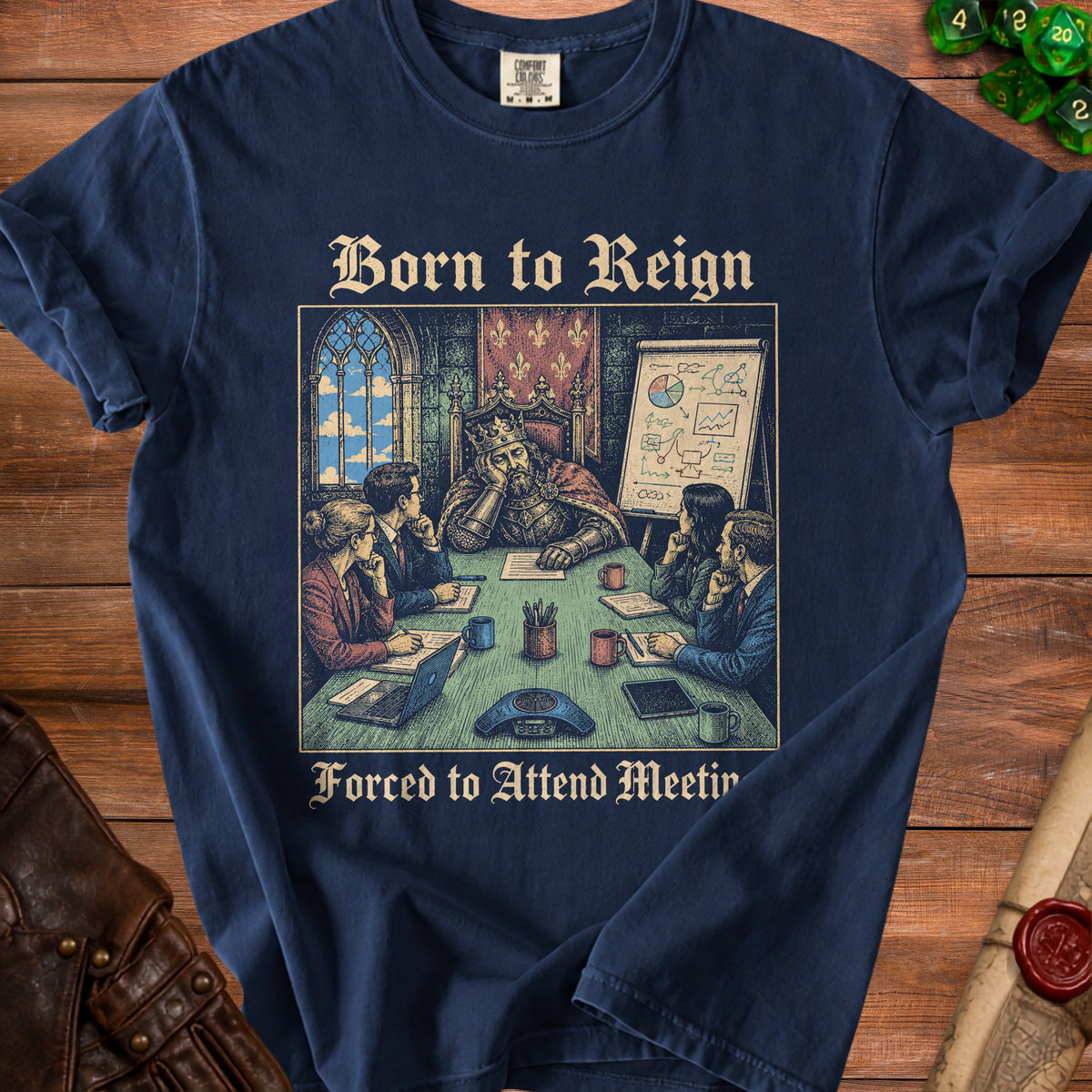 T-shirt graphic: king at meeting, text "Born to Reign Forced to Attend Meeting".