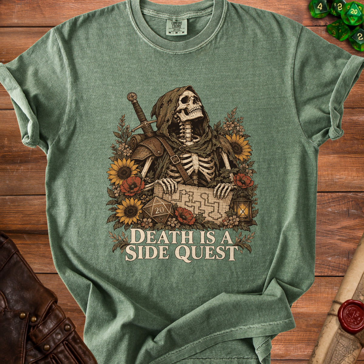 Green t-shirt with a grim reaper skeleton graphic holding a map and sword.