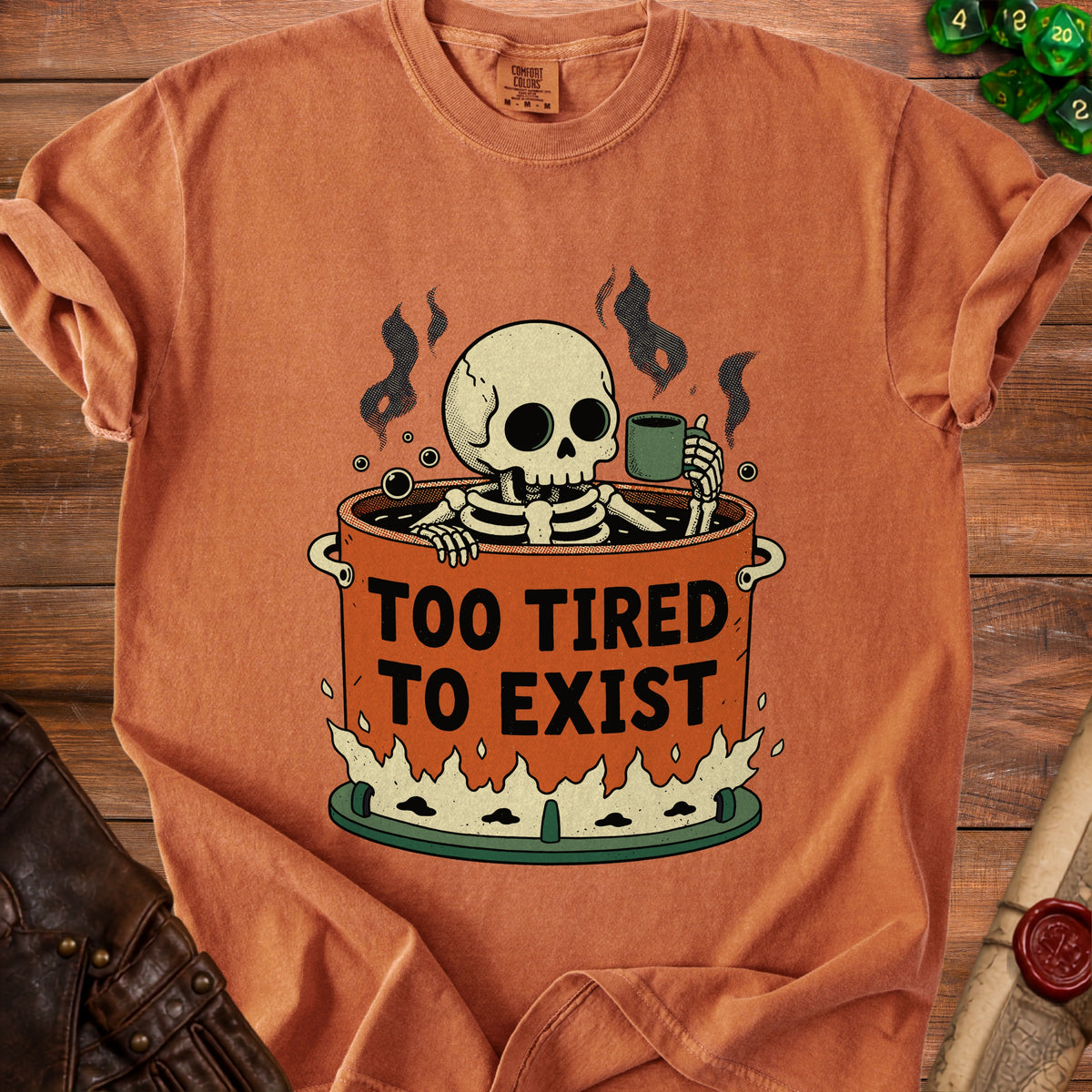 Skeleton in a pot holding coffee cup with text "TOO TIRED TO EXIST".
