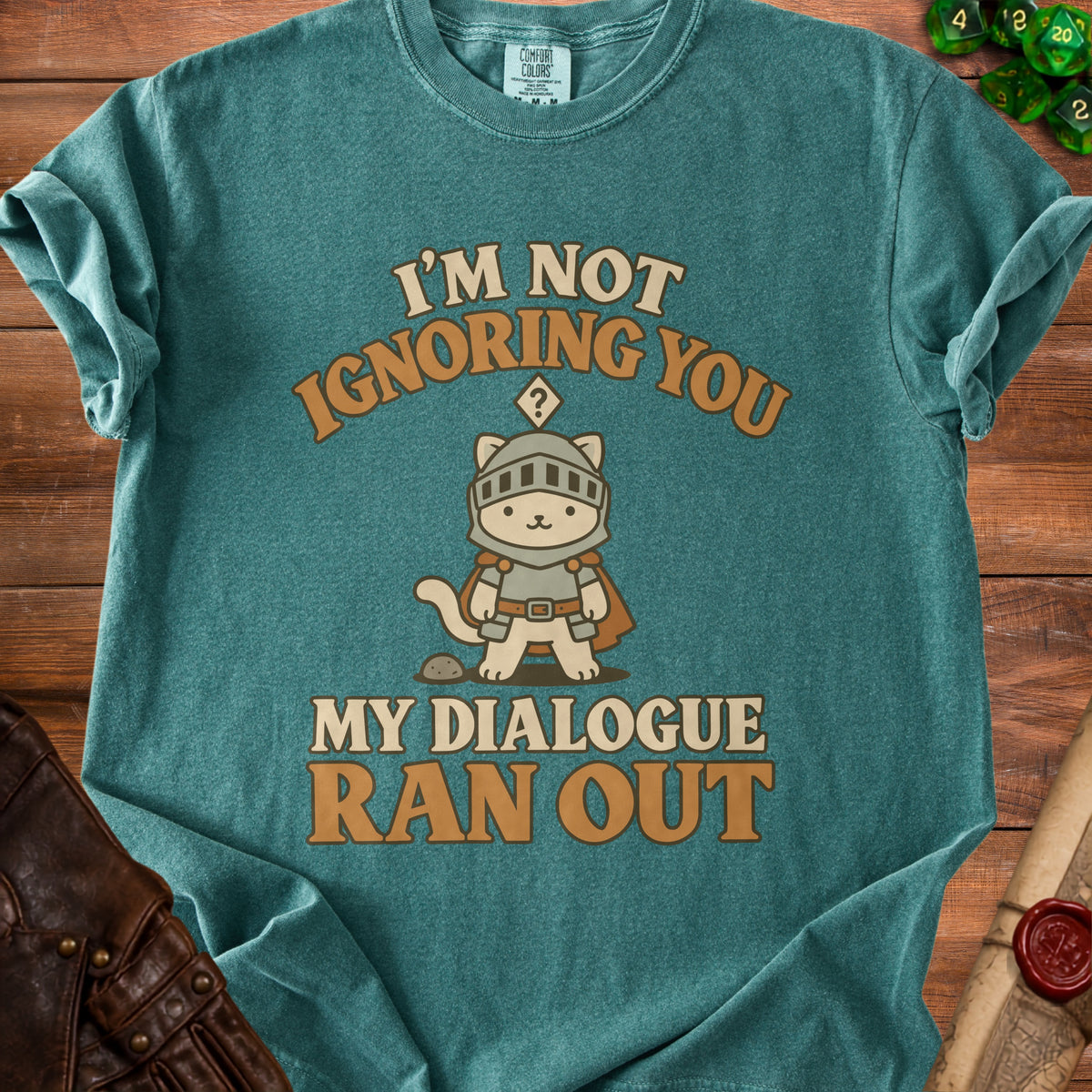 Teal t-shirt with a cartoon knight cat and text "I'm Not Ignoring You, My Dialogue Ran Out".