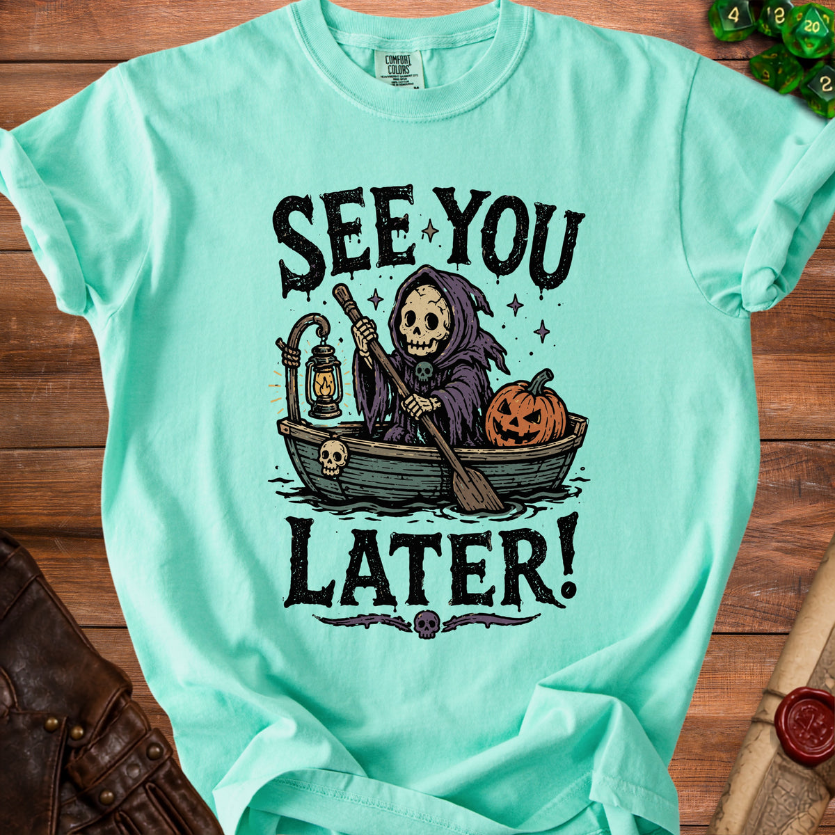 Grim Reaper rowing boat with pumpkin, "See You Later!" text.