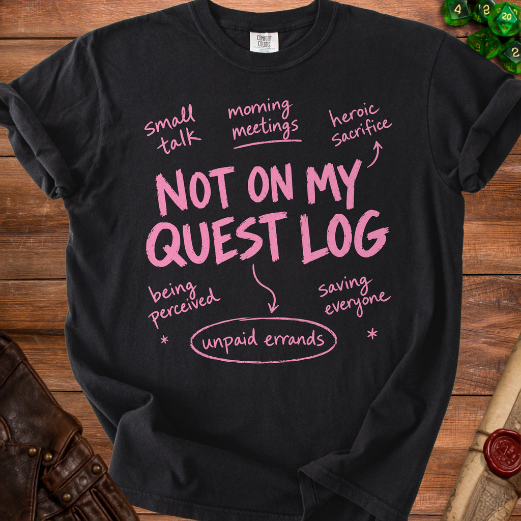 Black t-shirt with pink text "NOT ON MY QUEST LOG" and related phrases.