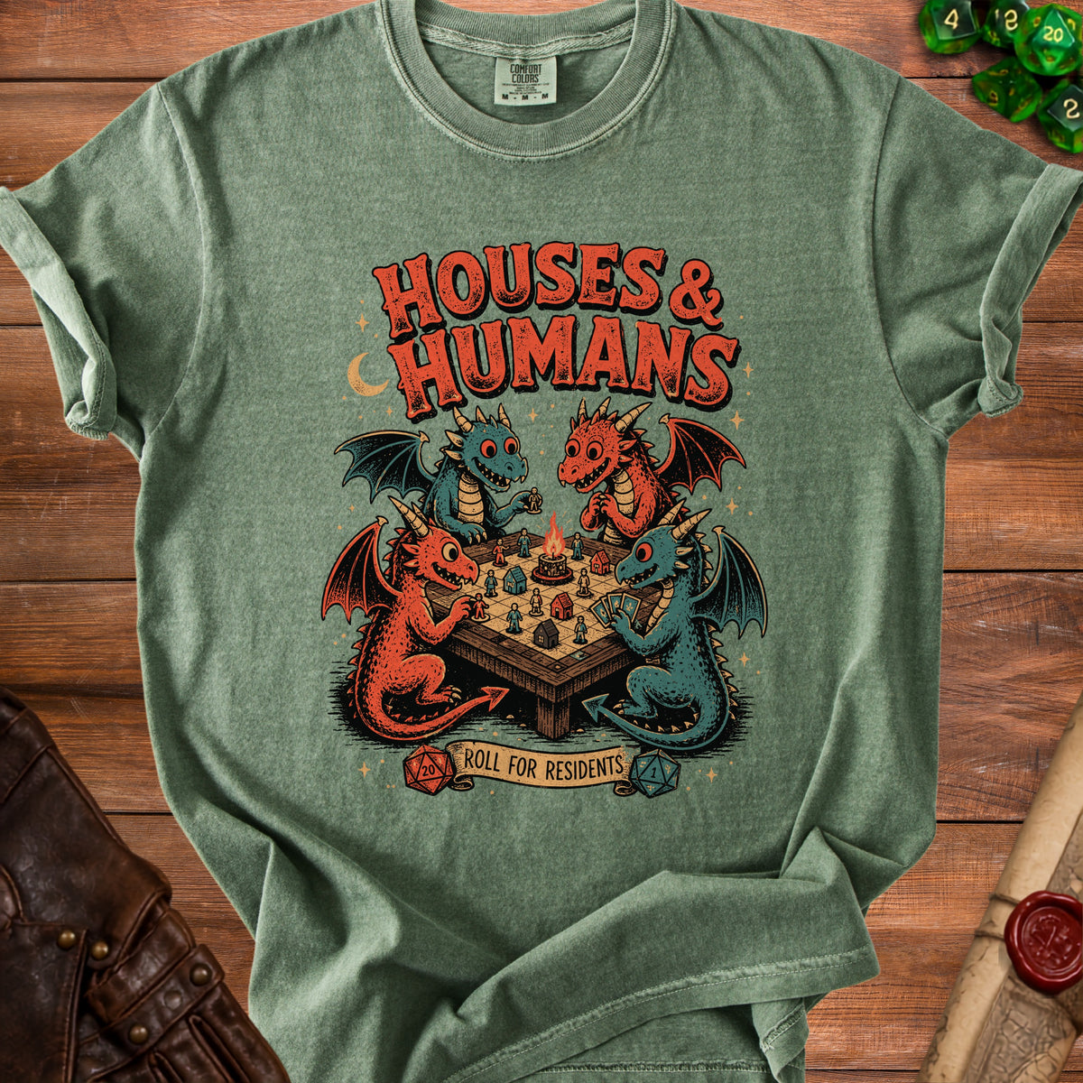 Green t-shirt with dragons playing board games and text "HOUSES & HUMANS Roll for Residents".