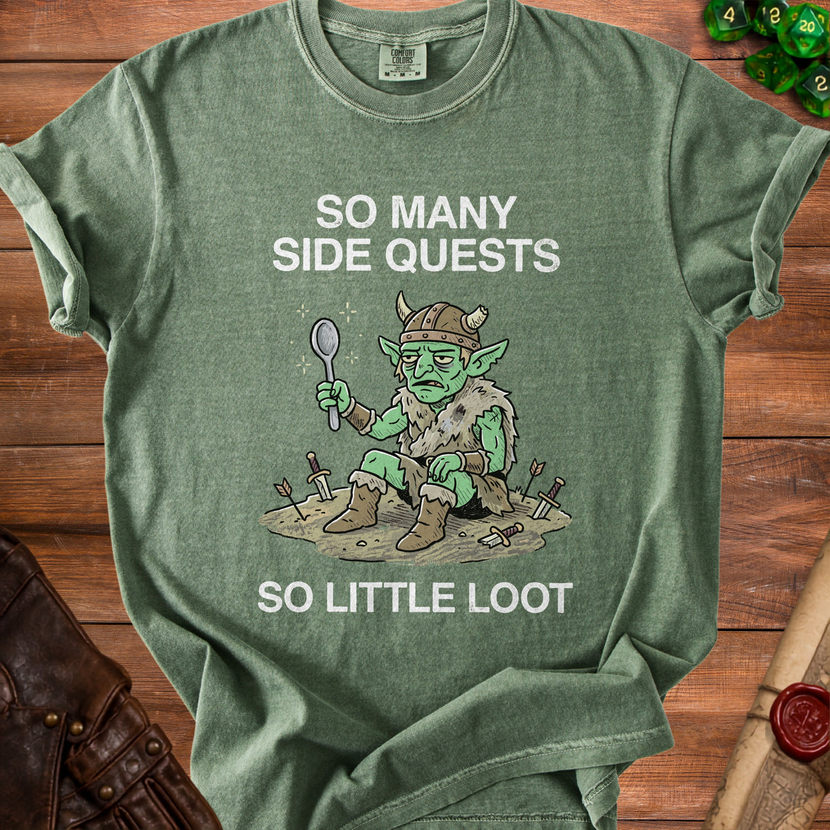 Green t-shirt with a goblin holding a spoon, text reads "So Many Side Quests, So Little Loot."