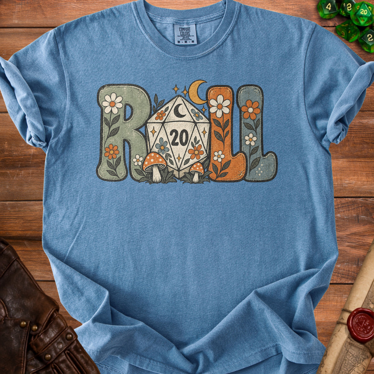 Blue t-shirt with "Roll" in retro font, featuring a D20 die and mushrooms.