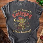 T-shirt with a goblin playing a banjo and the text "How Am I Supposed To Lollygag In These Conditions?".