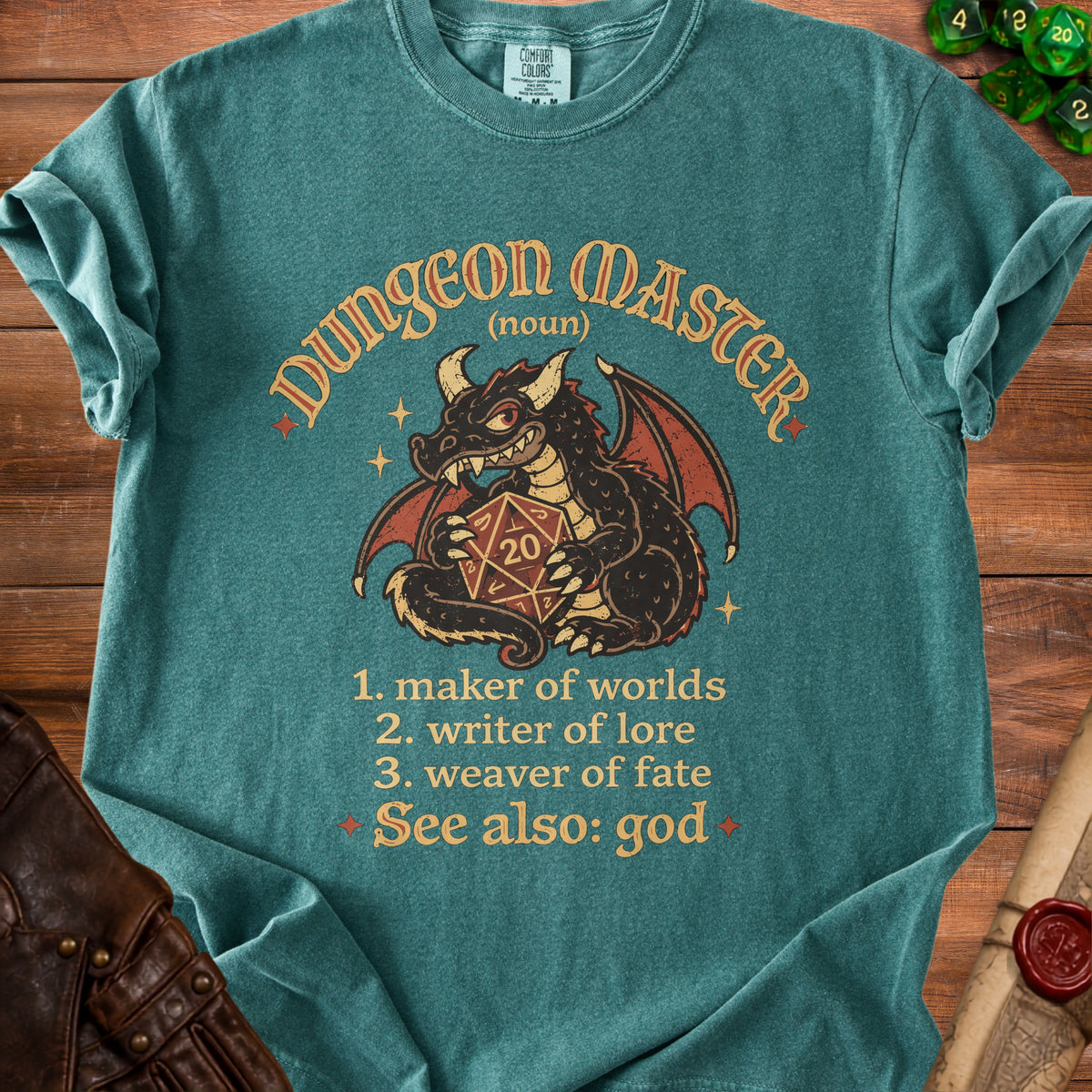 Teal t-shirt with a dragon holding a D20 die and "Dungeon Master" text.