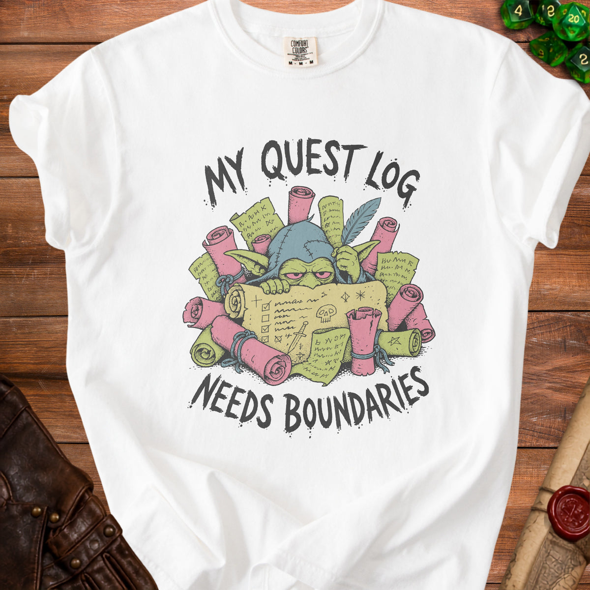 White t-shirt with a goblin graphic and the text "MY QUEST LOG NEEDS BOUNDARIES".