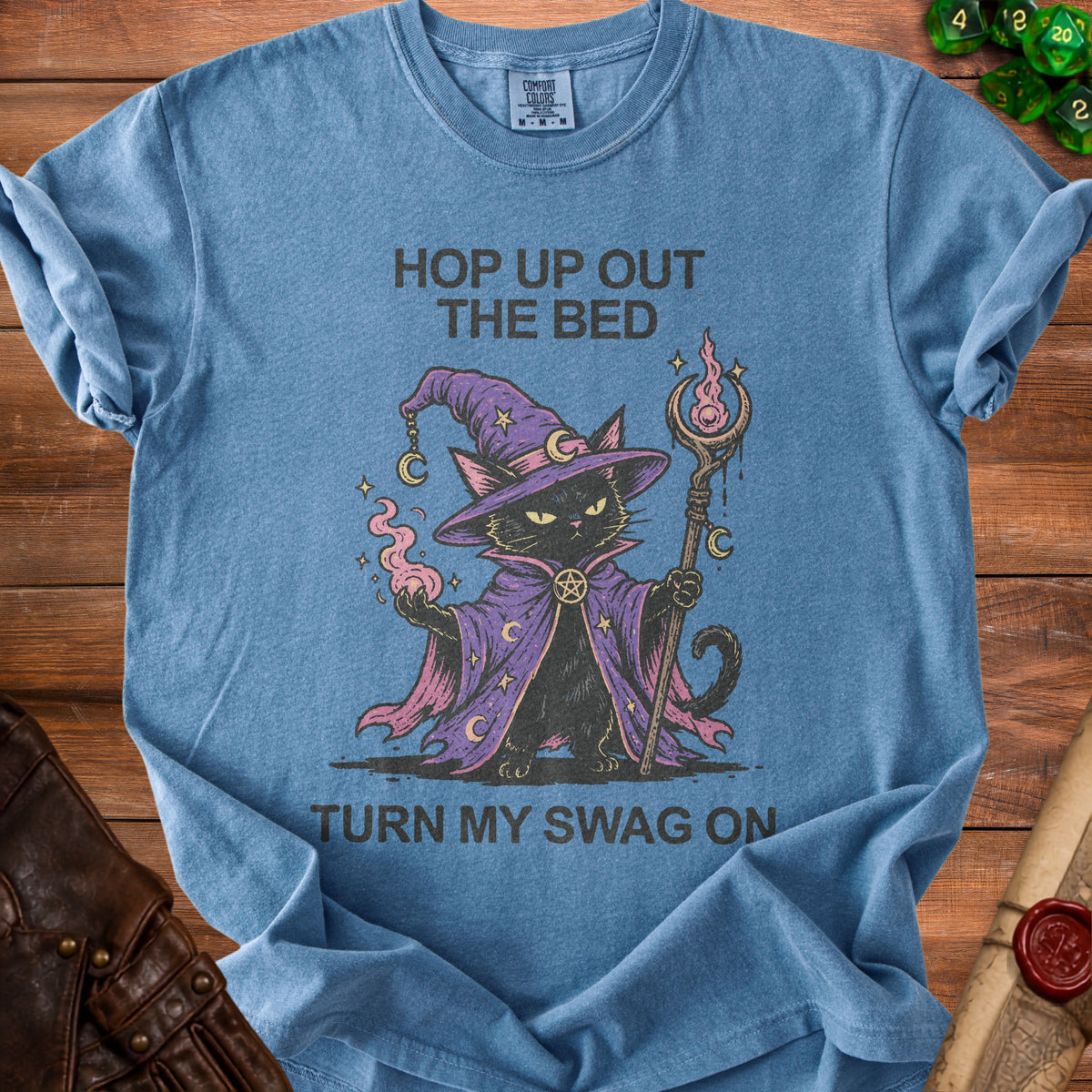 Blue t-shirt with wizard cat graphic and text "HOP UP OUT THE BED TURN MY SWAG ON".
