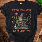 Black t-shirt with wizard frog graphic and text "Not All Spells Work But At Least I Try."