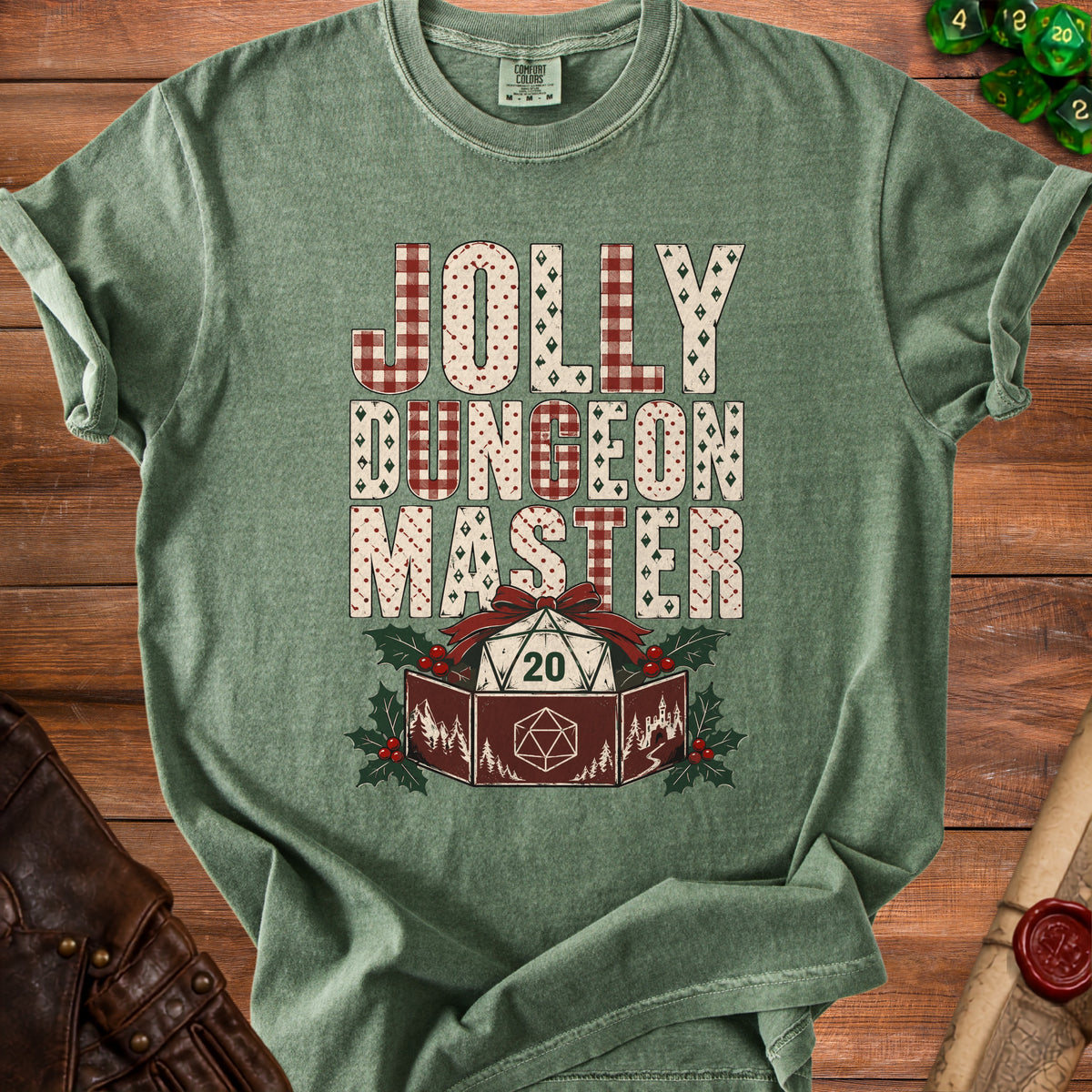 A muted green t-shirt with the text JOLLY DUNGEON MASTER and a d20 die graphic.