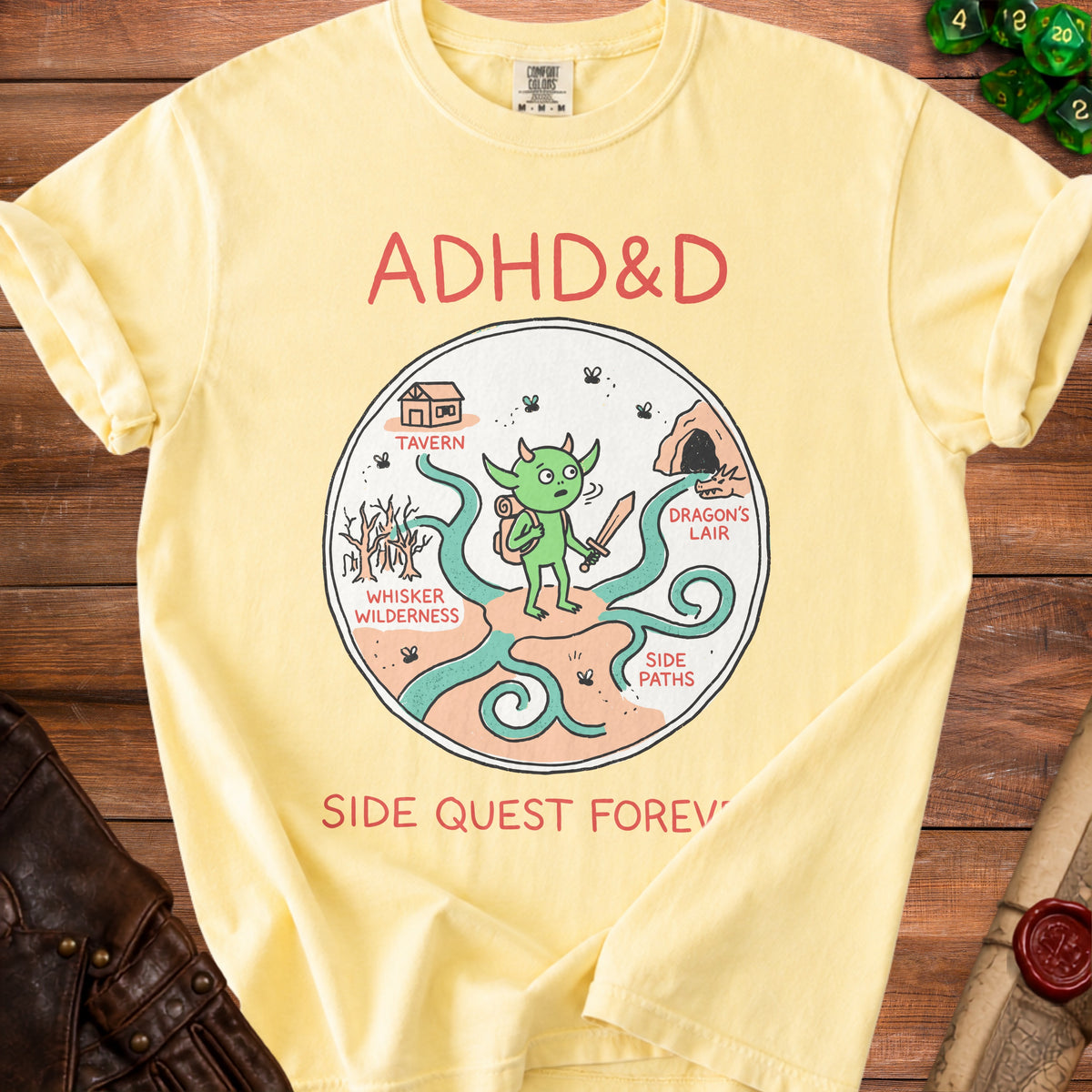 Yellow t-shirt with ADHD&D cartoon, tavern, dragon's lair, and side paths.