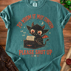 Teal t-shirt with a cartoon devil at a typewriter saying "Please Shut Up."