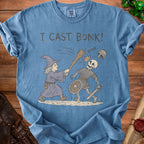 Blue t-shirt with wizard hitting skeleton with club, reads "I CAST BONK!".