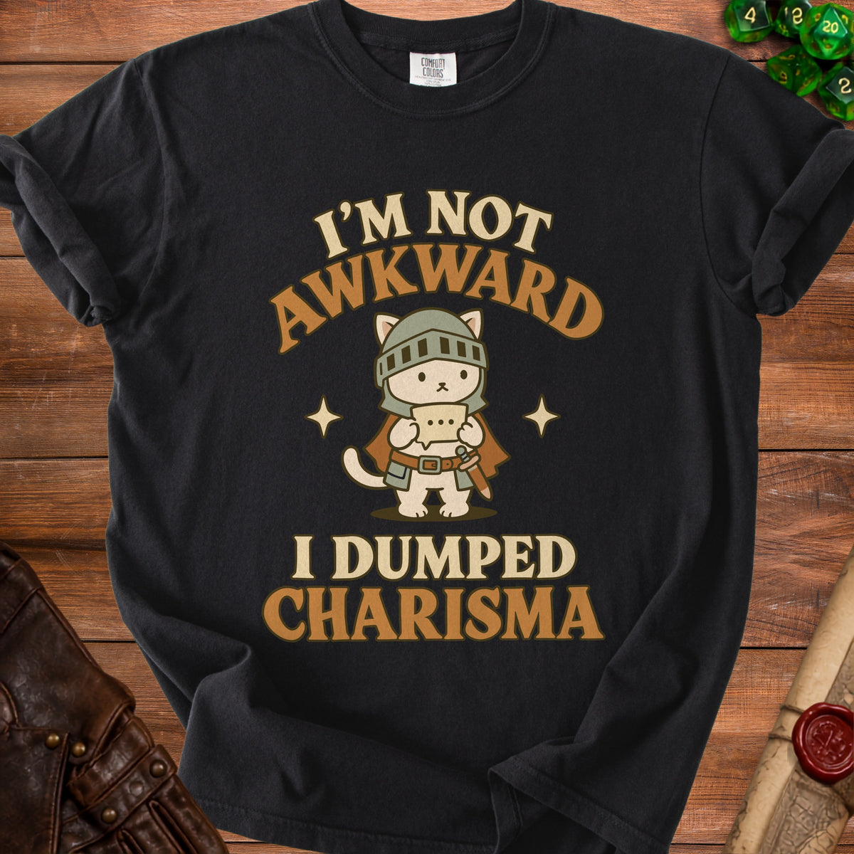 Black t-shirt with "I'm not awkward I dumped charisma" text and knight cat graphic.