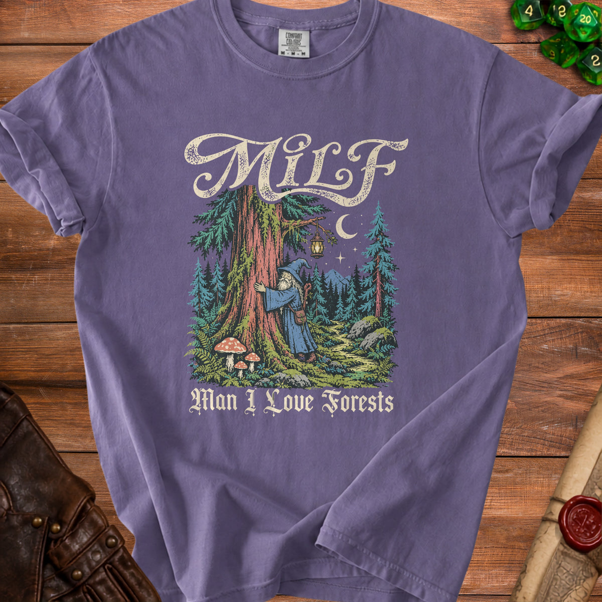 Purple t-shirt with a wizard in a forest and the text "MILF Man I Love Forests".