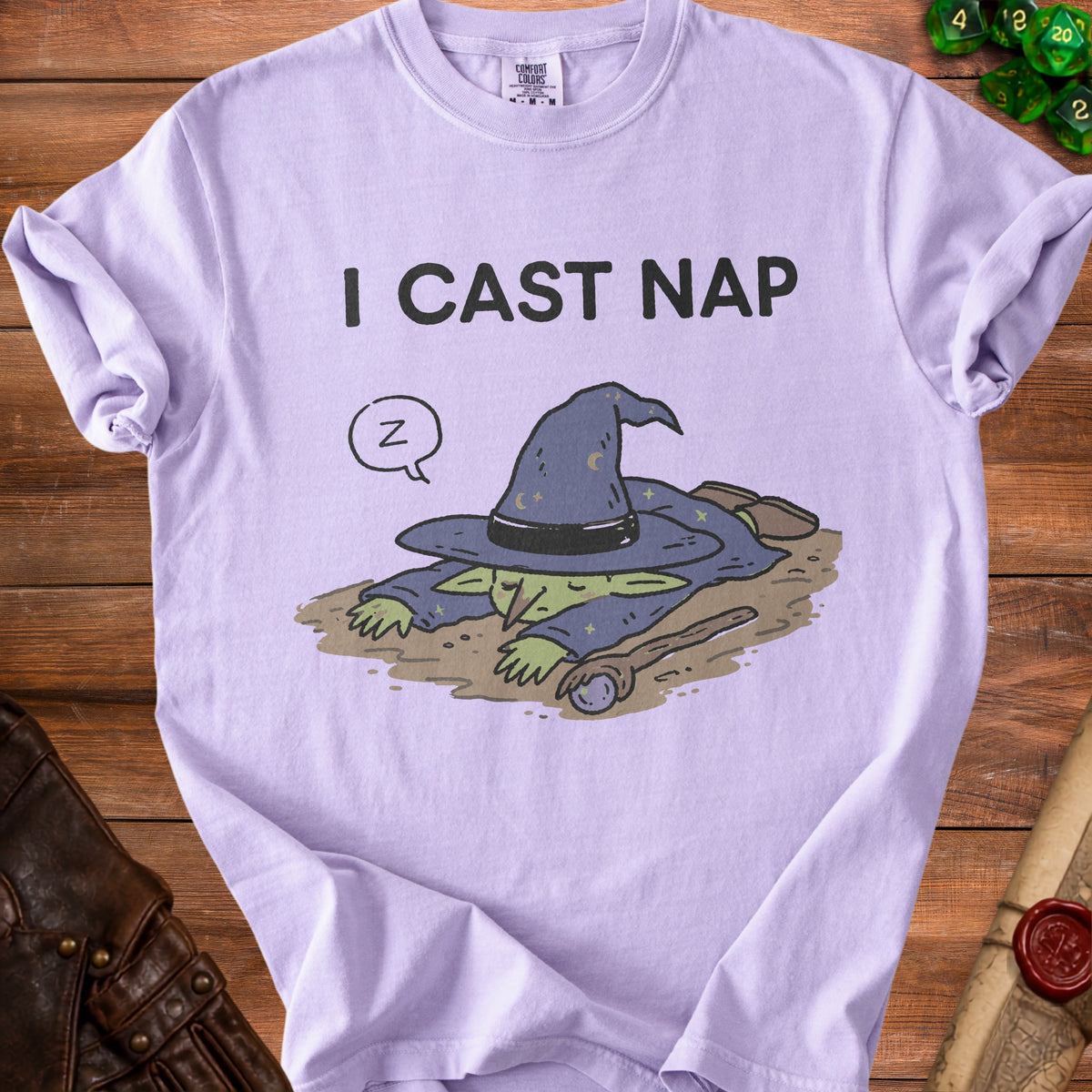 Purple t-shirt with cartoon goblin wizard sleeping and text "I CAST NAP".
