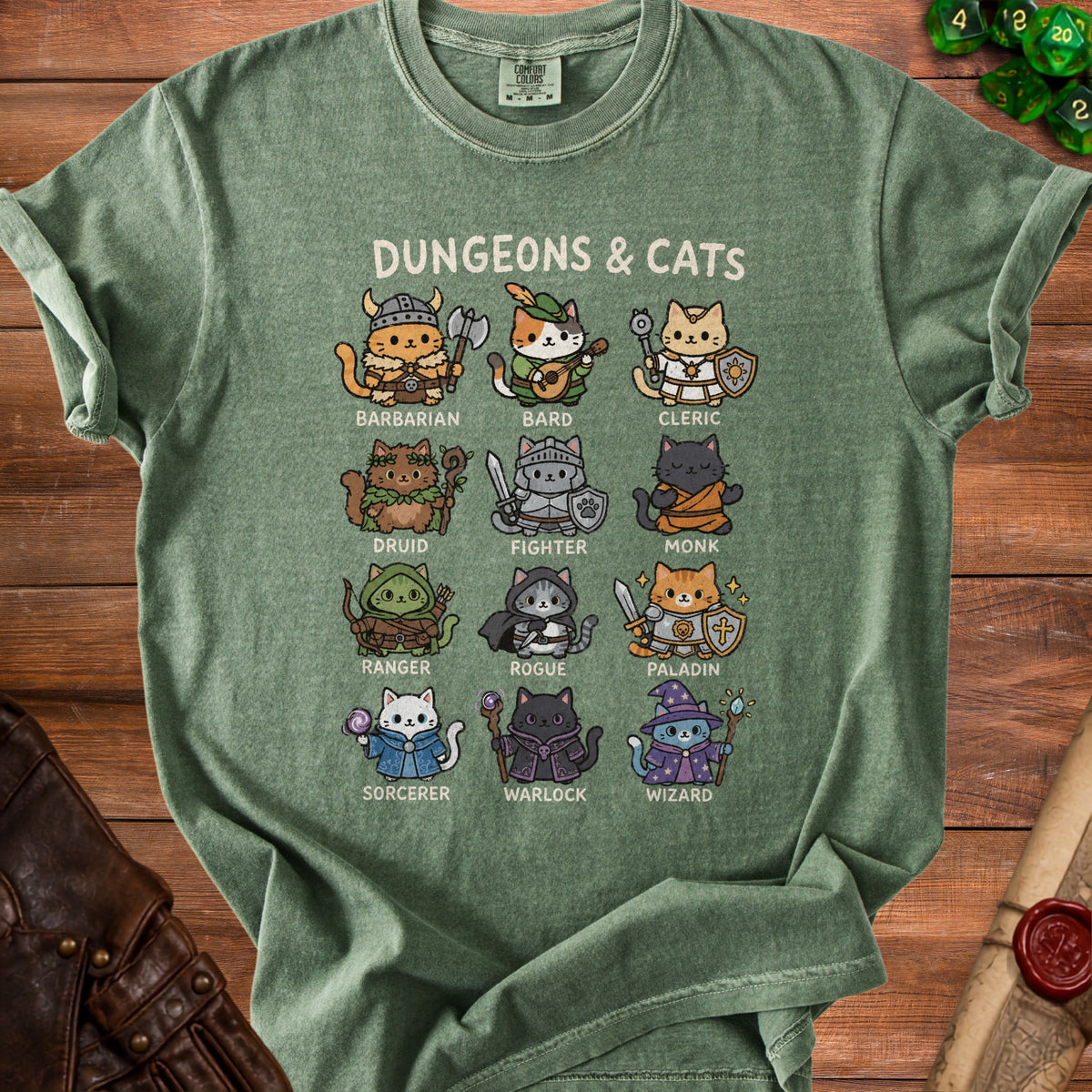 Green t-shirt with "Dungeons & Cats" and cartoon cats in fantasy roles.