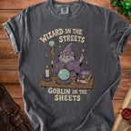 Gray t-shirt with cat wizard art and text "Wizard in the streets, goblin in the sheets."