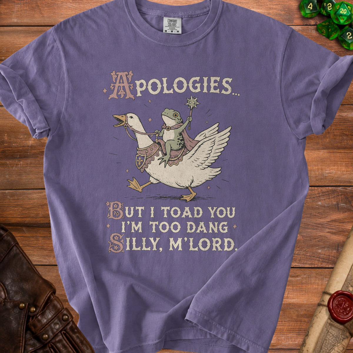 Purple t-shirt with a frog riding a goose and text "Apologies... But I toad you I'm too dang silly, m'lord."