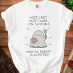 White t-shirt with ghost graphic saying "Not lazy, just low on spoons."