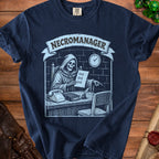 Dark blue t-shirt with "NECROMANAGER" text and skeleton graphic.