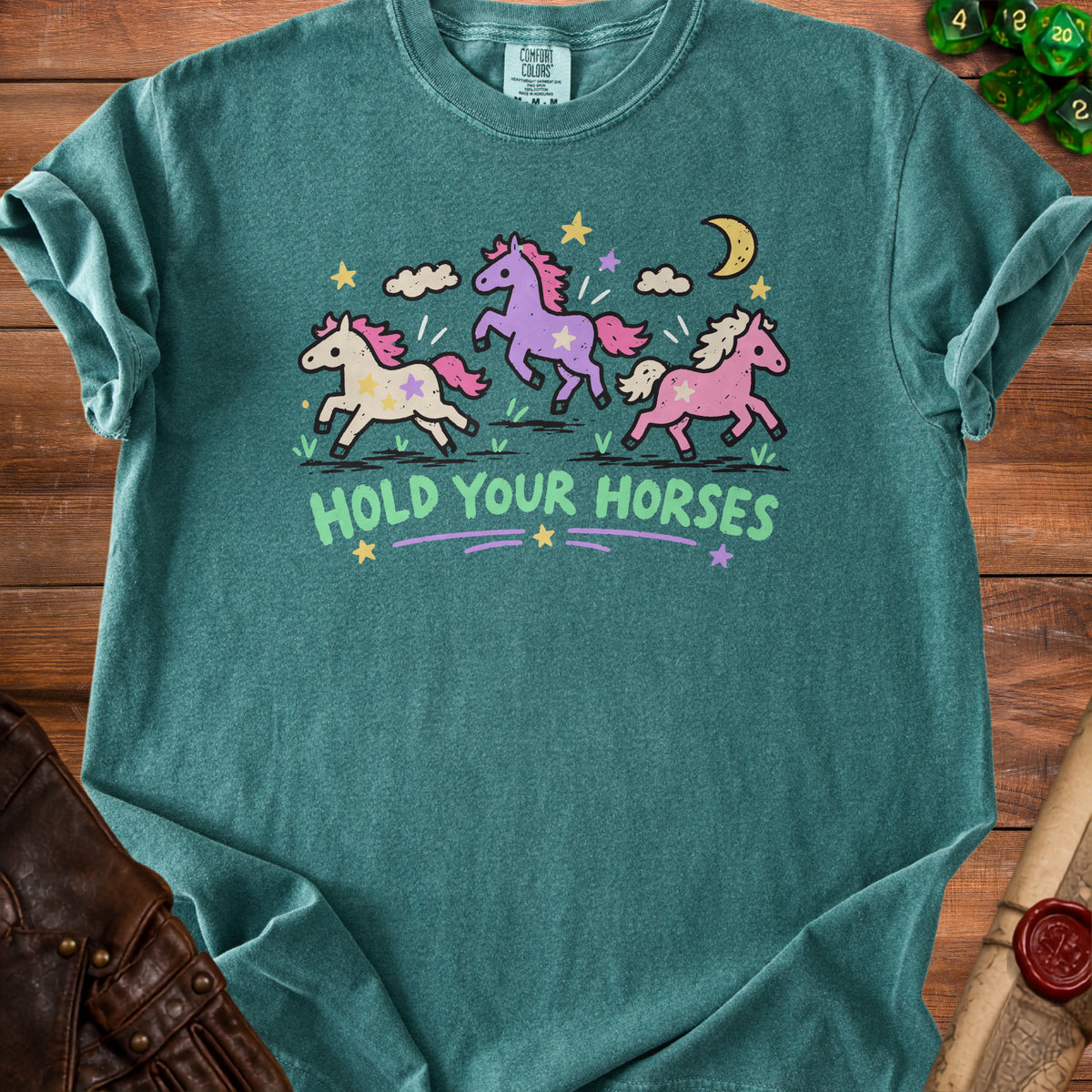 Teal t-shirt with "Hold Your Horses" and three colorful cartoon horses.