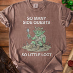 Brown t-shirt with cartoon goblin holding spoon, "So Many Side Quests So Little Loot".