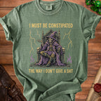 Green t-shirt with skeleton wizard on throne and text: "I must be constipated the way I don't give a shit."
