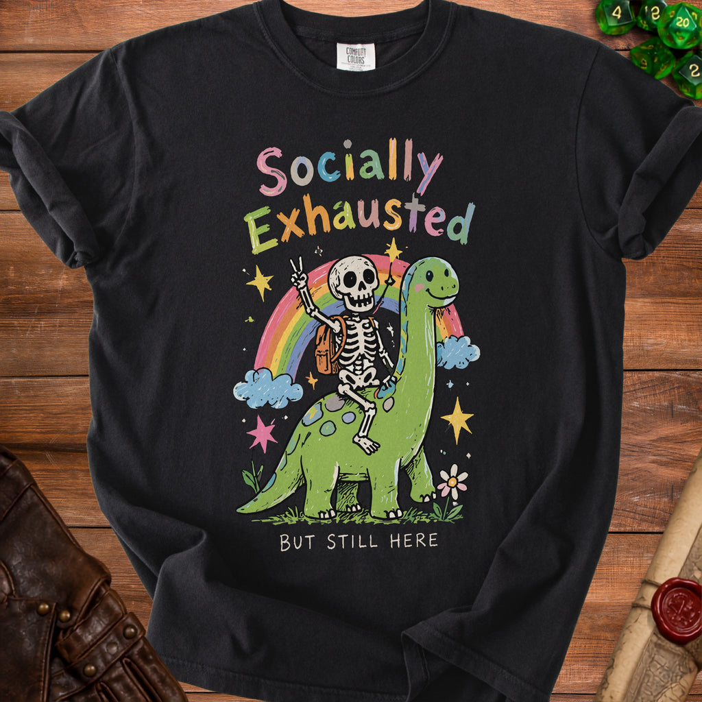 Skeleton riding a dinosaur under a rainbow, text "Socially Exhausted But Still Here".
