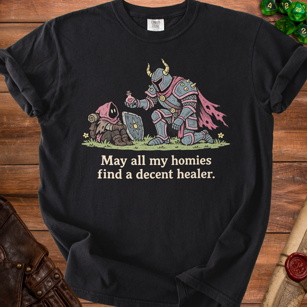 Black t-shirt with illustration of knight giving potion to gnome and text "May all my homies find a decent healer."