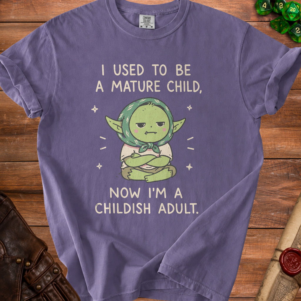Purple t-shirt with text "I used to be a mature child, now I'm a childish adult."